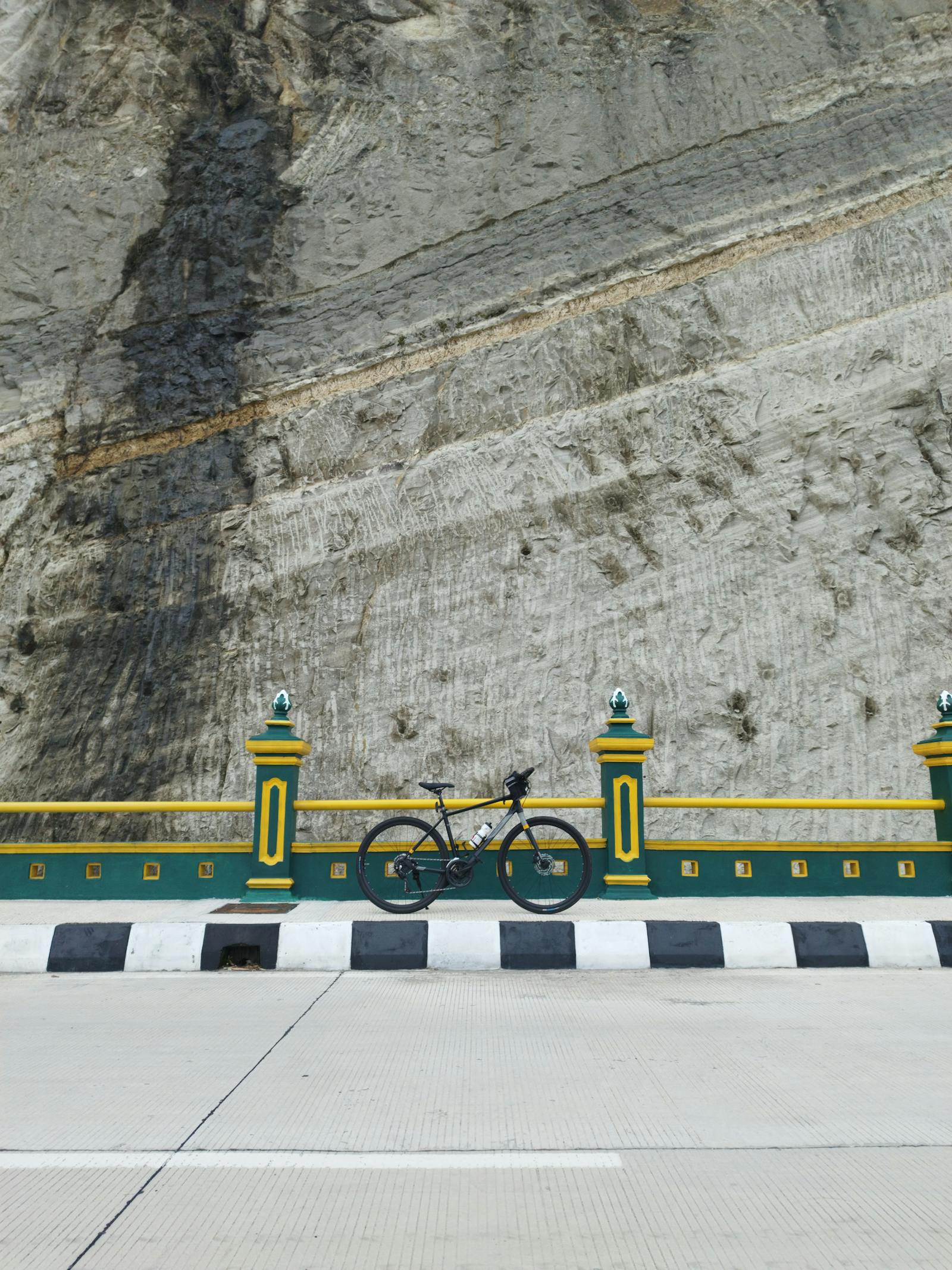 Bike next to a big rock in Yogyakarta Indonesia