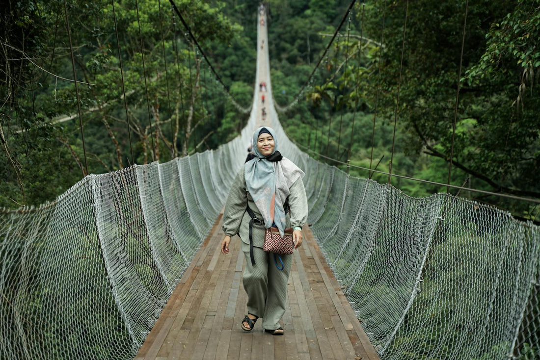 Woman walks on Sukabumi bridge in Indonesia