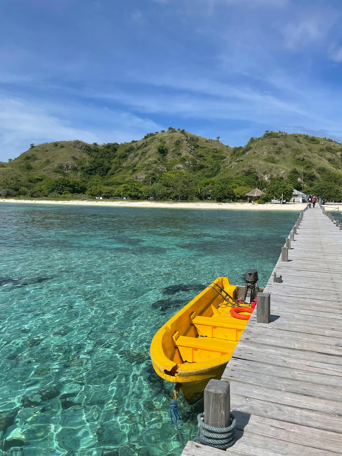 Yellow boat sits at a pier in Indonesia