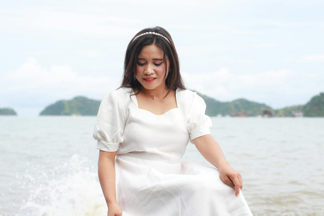 Woman in white dress on the beach in Indonesia