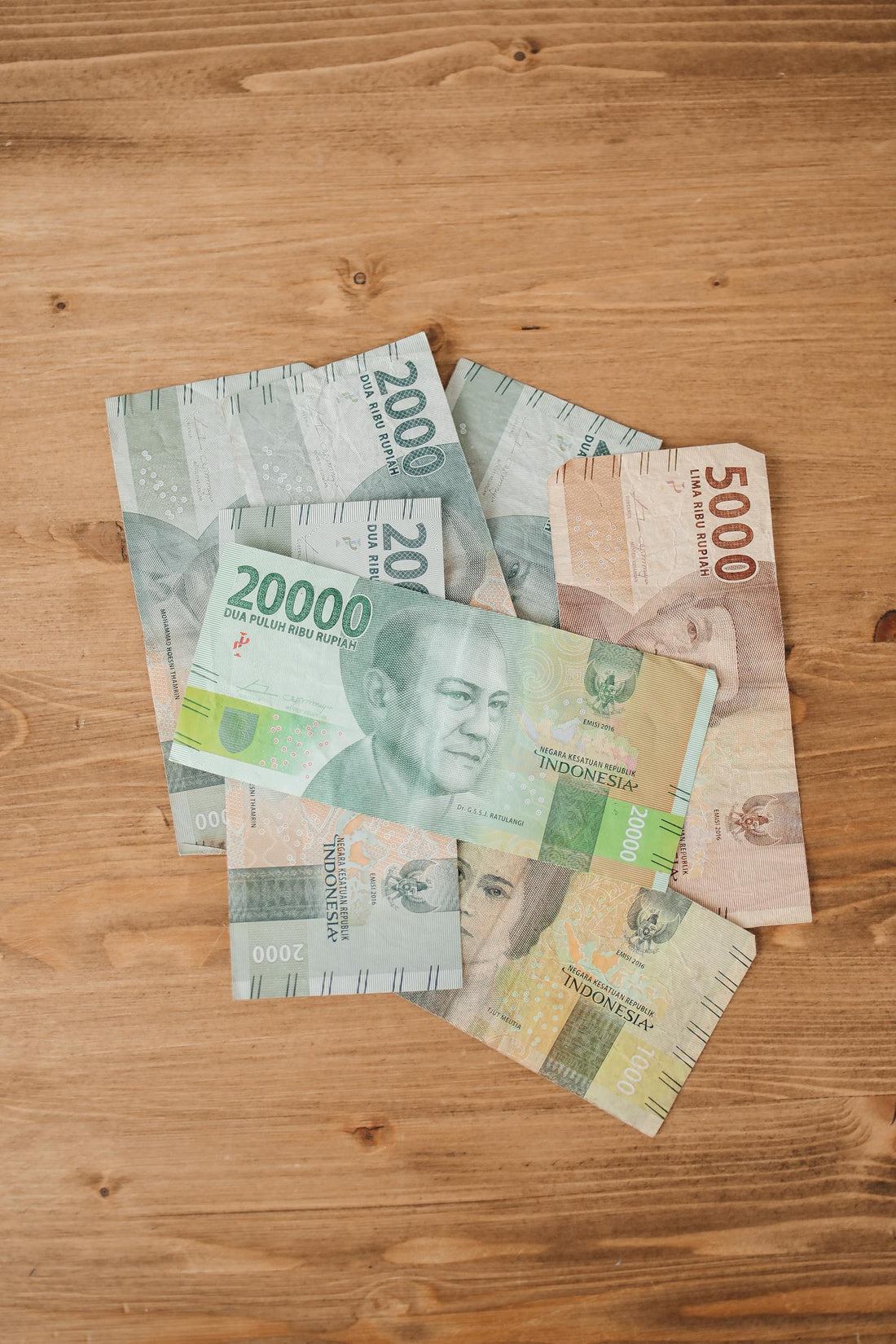Indonesian money is on a wooden table