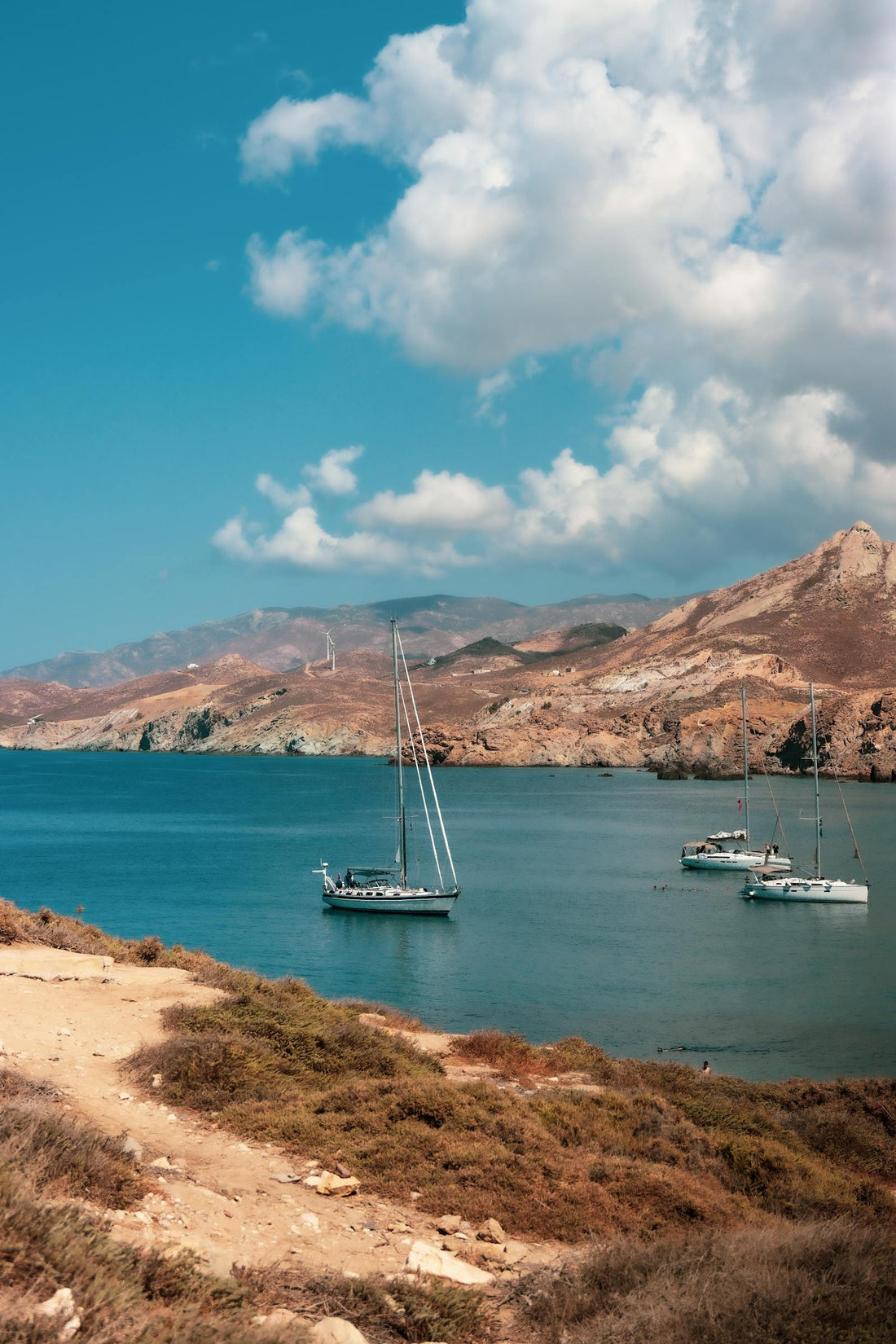 Boats Sailing in Naxos Greece Blue Sky