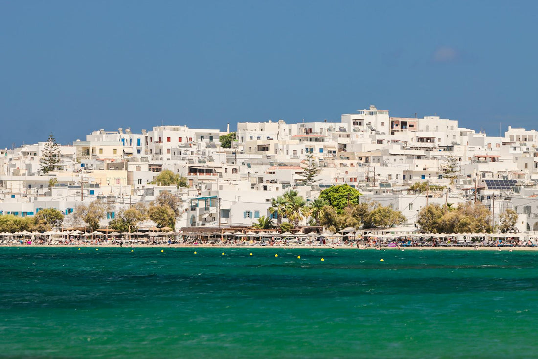Blue water and old buildings in Naxos Greece