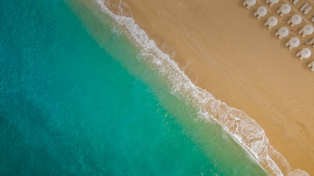 Sandy beach with blue waves in Lefkada Greece