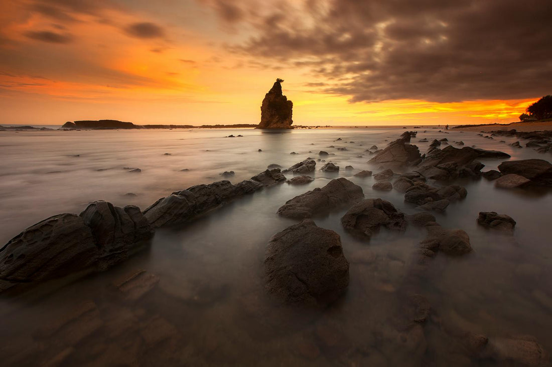Tips for taking pictures of calm sunsets by the water