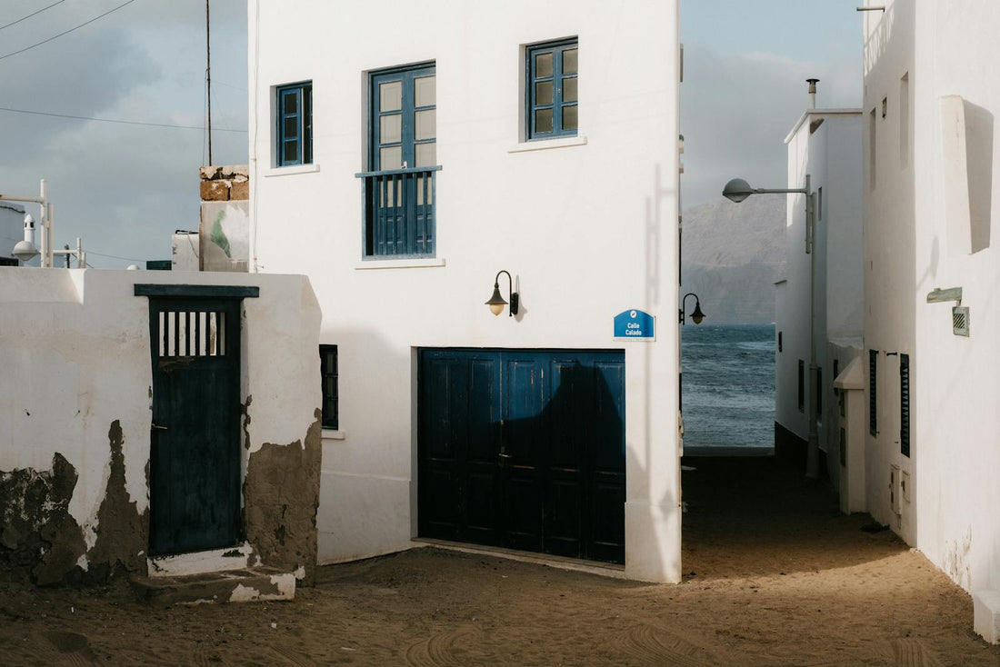 Caleta de Famara White Buildings by the Sea in Spain