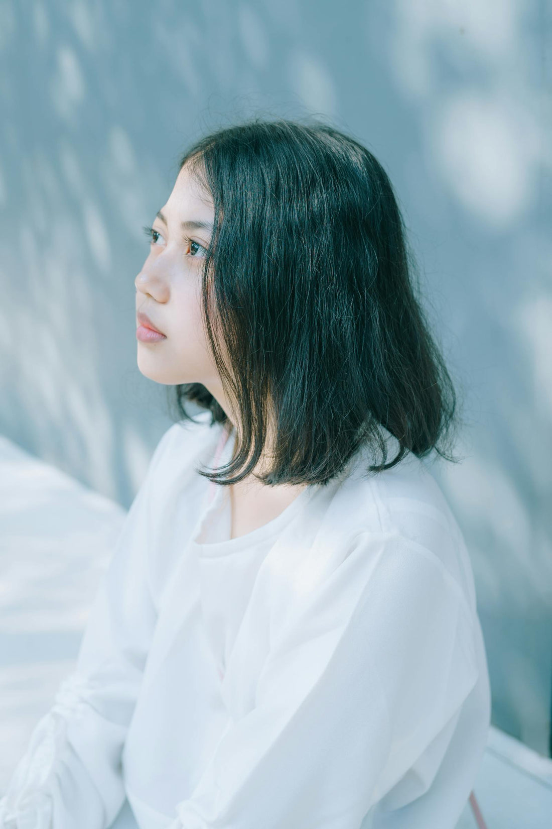 Serene young woman in Indonesian sunlight
