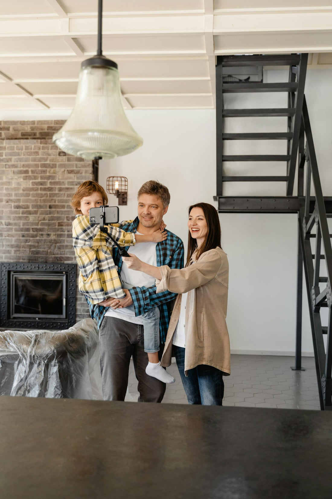 Family making a video in their new home