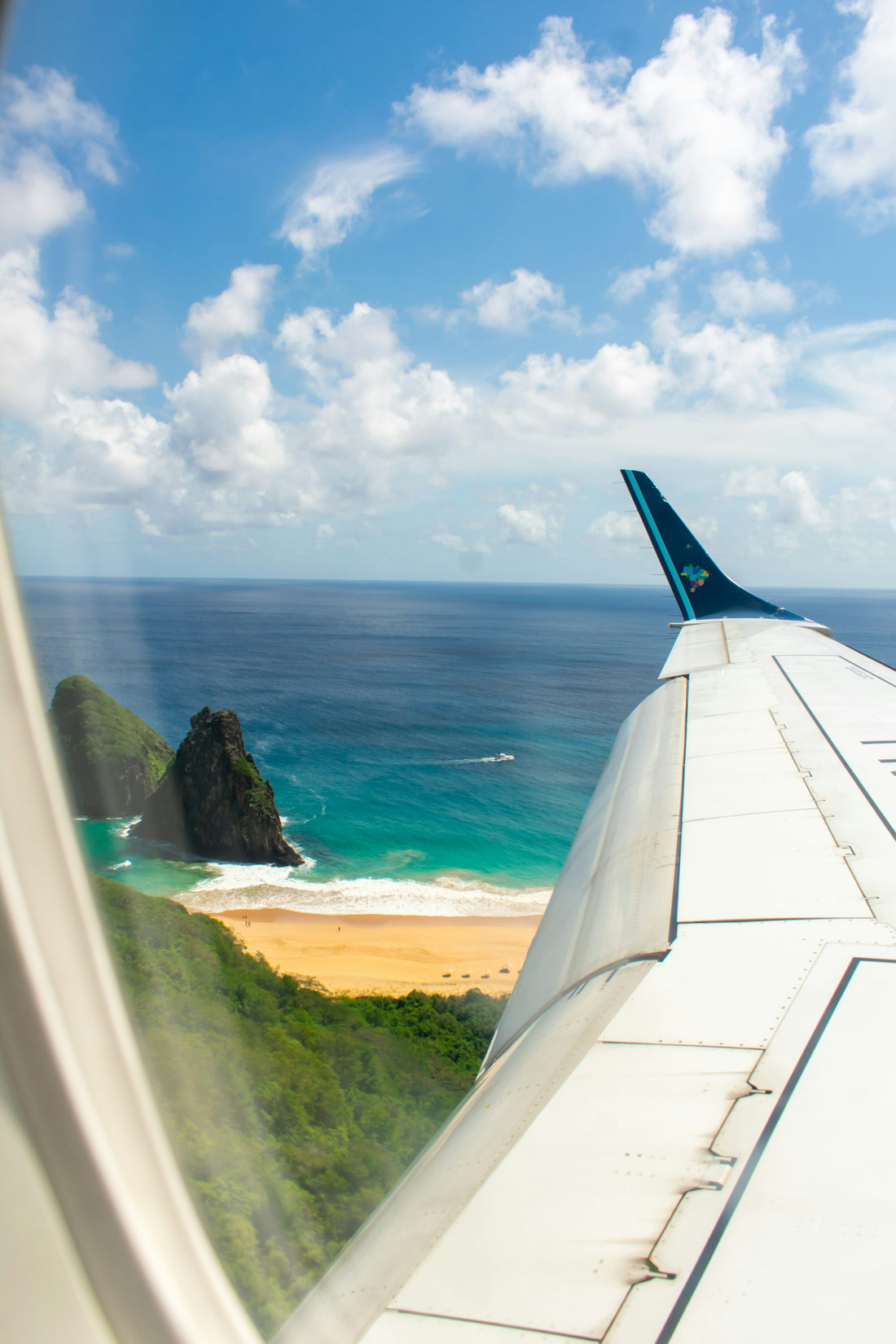 An airplane wing over the sea near Brazil