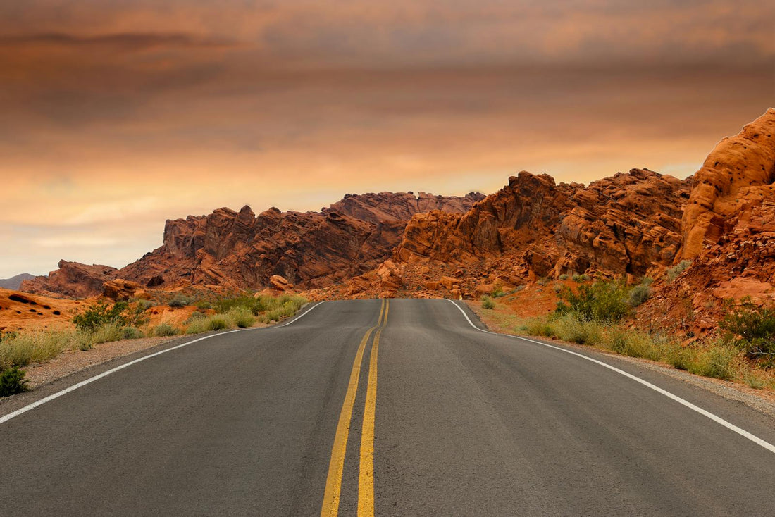 Travel tips for driving through desert rocks at sunset
